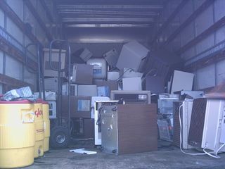 truck full of old dehumidifiers and air conditioners